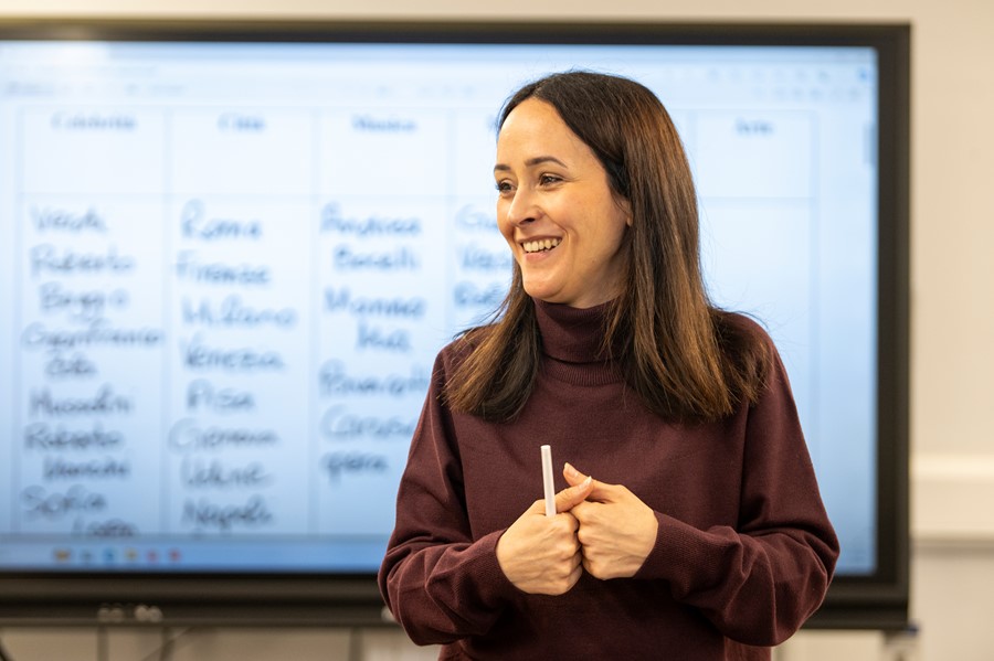 Teacher standing in front of a whiteboard