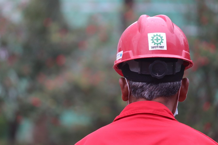 Man wearing a red hard hat