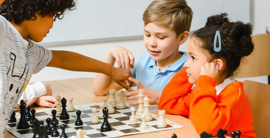 3 children playing chess