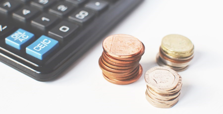 Calculator with three stacks of coins