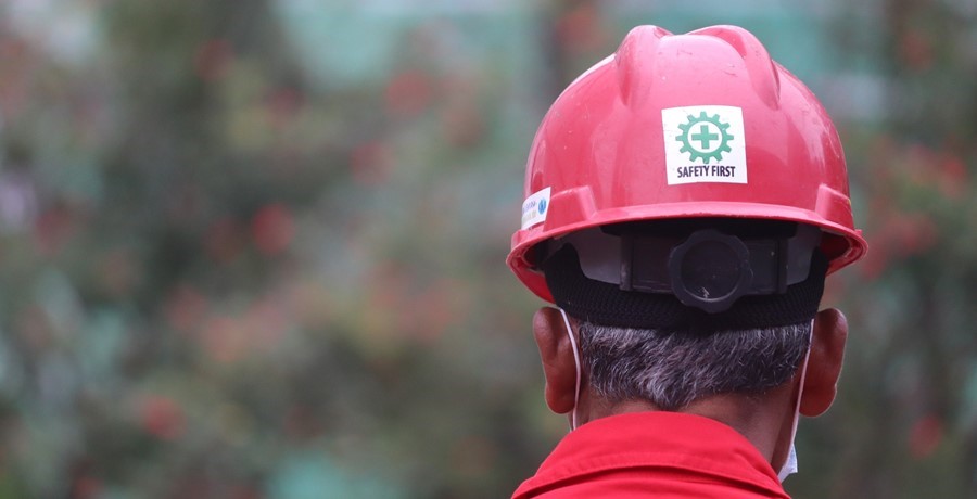 Man wearing a red hard hat