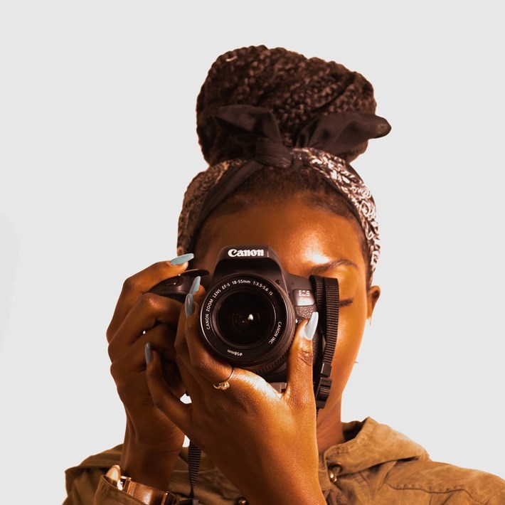 woman holding a camera