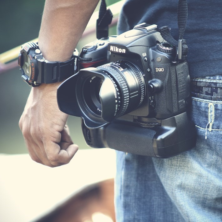 digital camera next to a man's arm