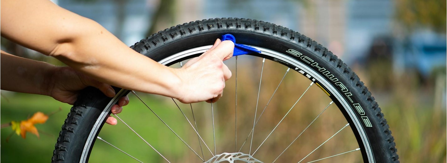 Mechanic fixing a car tyre