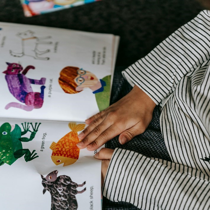 Child reading from a book