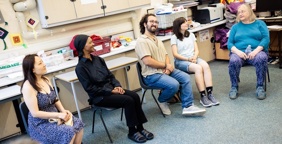 Group of people sitting in a row