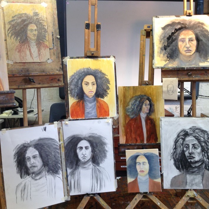 A selection of portraits on easels