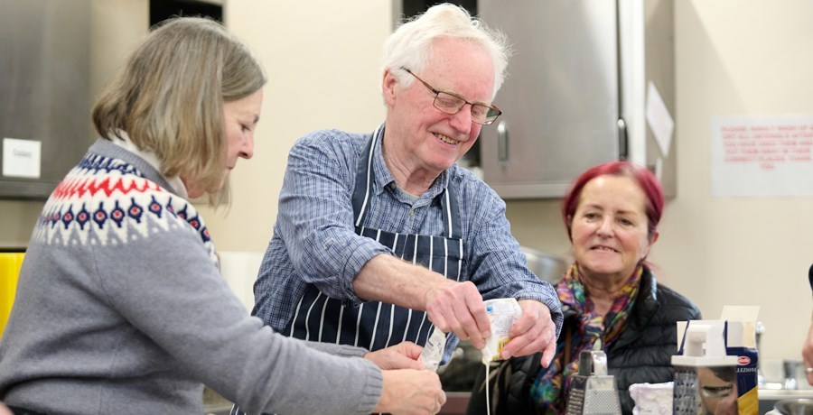 A group cooking in the kitchen