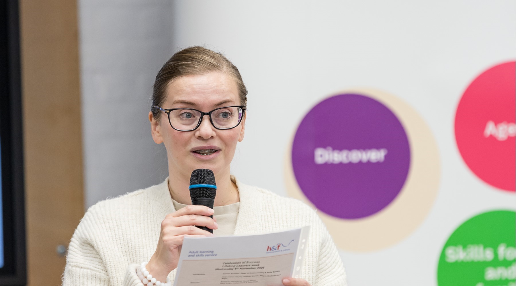 Woman holding a microphone